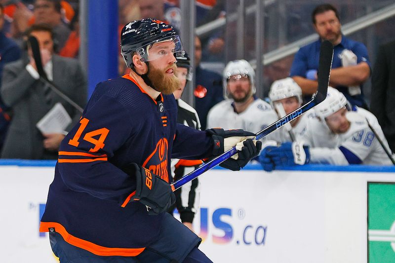 Dec 14, 2023; Edmonton, Alberta, CAN; Edmonton Oilers defensemen Mattias Ekholm (14) follows the play against the Tampa Bay Lightning at Rogers Place. Mandatory Credit: Perry Nelson-USA TODAY Sports