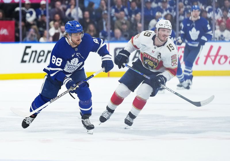 May 7, 2025; Toronto, Ontario, CAN; Toronto Maple Leafs right wing William Nylander (88) skates with Florida Panthers left wing Matthew Tkachuk (19) during the third period in game two of the second round of the 2025 Stanley Cup Playoffs at Scotiabank Arena. Mandatory Credit: Nick Turchiaro-Imagn Images