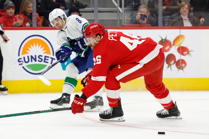 Dec 1, 2024; Detroit, Michigan, USA;  Vancouver Canucks right wing Conor Garland (8) is defended by Detroit Red Wings defenseman Jeff Petry (46) in the third period at Little Caesars Arena. Mandatory Credit: Rick Osentoski-Imagn Images