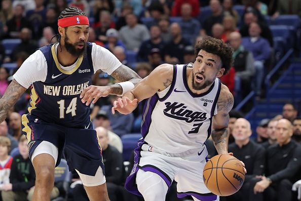 NEW ORLEANS, LOUISIANA - NOVEMBER 22: Chris Duarte #3 of the Sacramento Kings drives against Brandon Ingram #14 of the New Orleans Pelicans during the first half at the Smoothie King Center on November 22, 2023 in New Orleans, Louisiana. NOTE TO USER: User expressly acknowledges and agrees that, by downloading and or using this Photograph, user is consenting to the terms and conditions of the Getty Images License Agreement. (Photo by Jonathan Bachman/Getty Images)