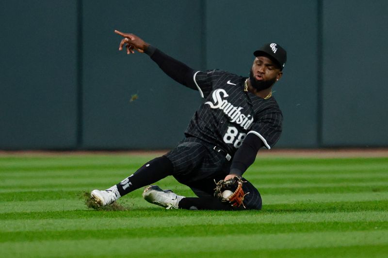 Aug 10, 2024; Chicago, Illinois, USA; Chicago White Sox outfielder Luis Robert Jr. (88) catches a fly ball hit by Chicago Cubs outfielder Pete Crow-Armstrong during the sixth inning at Guaranteed Rate Field. Mandatory Credit: Kamil Krzaczynski-USA TODAY Sports