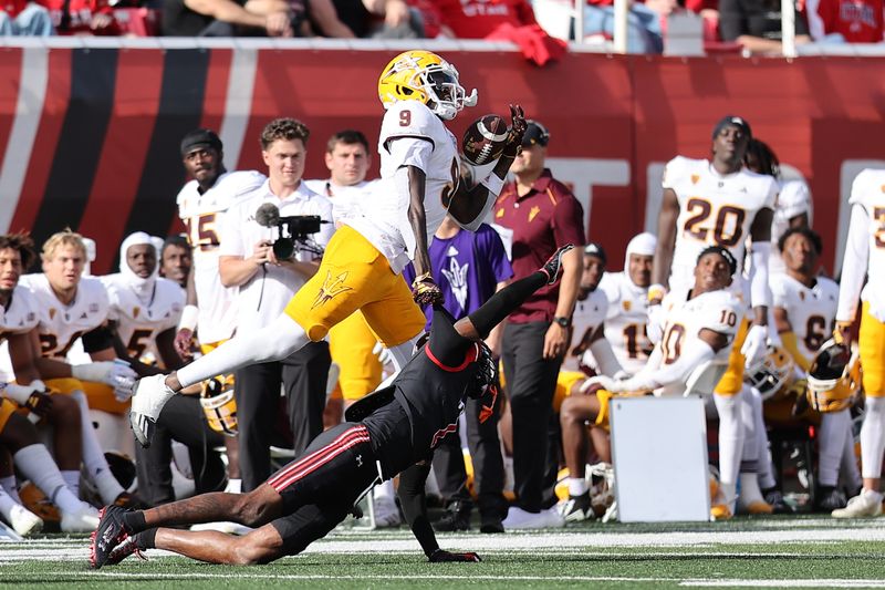 Nov 4, 2023; Salt Lake City, Utah, USA; Utah Utes cornerback Miles Battle (1) and Arizona State Sun Devils wide receiver Troy Omeire (9) play for a pass that is called back for a penalty in the third quarter at Rice-Eccles Stadium. Mandatory Credit: Rob Gray-USA TODAY Sports