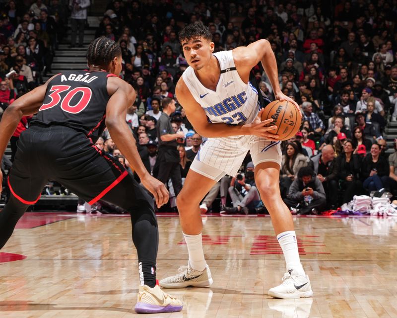 TORONTO, CANADA - JANUARY 3: Tristan da Silva #23 of the Orlando Magic looks on during the game against the Toronto Raptors on January 3, 2025 at the Scotiabank Arena in Toronto, Ontario, Canada.  NOTE TO USER: User expressly acknowledges and agrees that, by downloading and or using this Photograph, user is consenting to the terms and conditions of the Getty Images License Agreement.  Mandatory Copyright Notice: Copyright 2025 NBAE(Photo by Mark Blinch/NBAE via Getty Images)