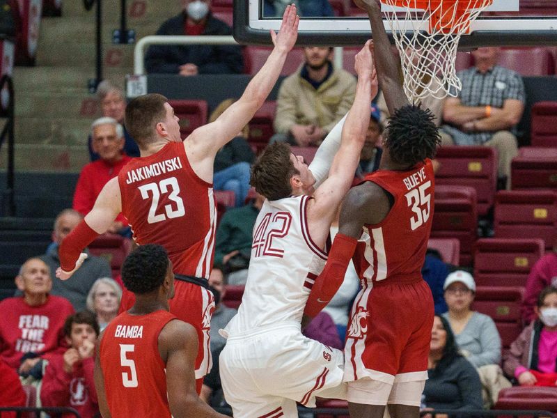 Feb 23, 2023; Stanford, California, USA;  Stanford Cardinal forward Maxime Raynaud (42) shoots a layup against Washington State Cougars forward Mouhamed Gueye (35) during the second half at Maples Pavilion. Mandatory Credit: Neville E. Guard-USA TODAY Sports