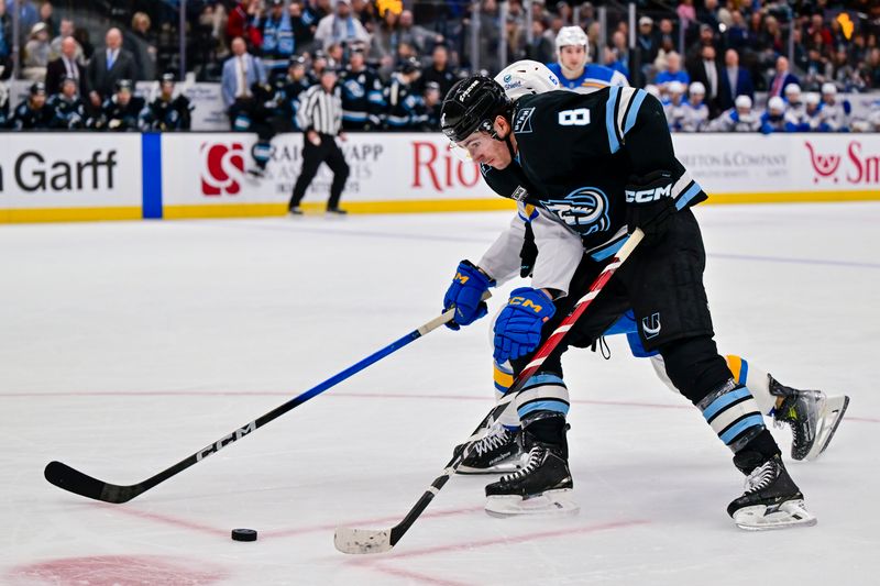 Jan 9, 2026; Salt Lake City, Utah, USA; Utah Mammoth center Nick Schmaltz (8) makes a fast break during second period against St. Louis Blues defenseman Philip Broberg (6) at Delta Center. Mandatory Credit: Peter Creveling-Imagn Images