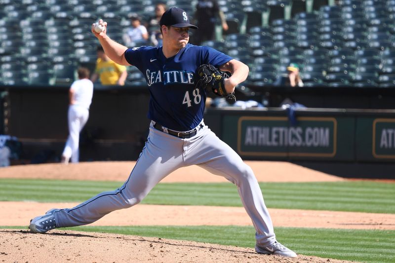 Sep 20, 2023; Oakland, California, USA; Seattle Mariners relief pitcher George Kirby (68) throws against the Oakland Athletics during the ninth inning at Oakland-Alameda County Coliseum. Mandatory Credit: Kelley L Cox-USA TODAY Sports