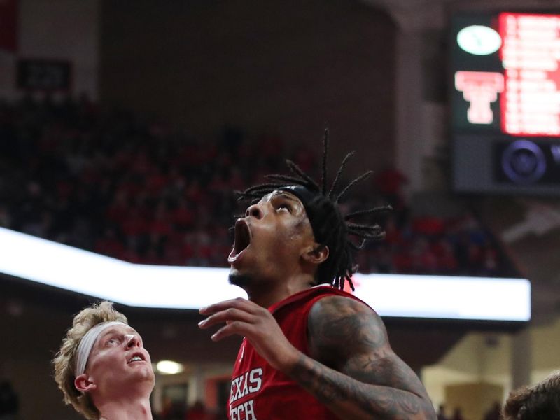 Jan 17, 2026; Lubbock, Texas, USA;  Texas Tech Red Raiders forward JT Toppin (15) reacts after scoring against BYU Cougars guard Richie Saunders (15) in the second half at United Supermarkets Arena. Mandatory Credit: Michael C. Johnson-Imagn Images
