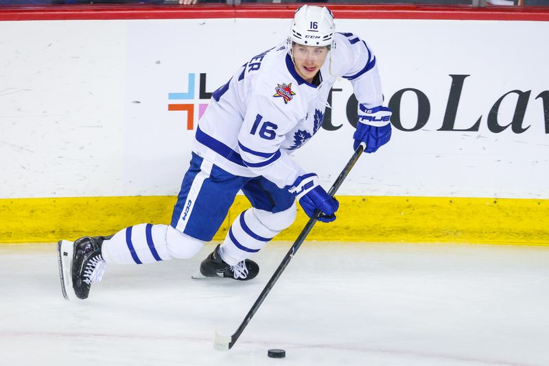 Jan 18, 2024; Calgary, Alberta, CAN; Toronto Maple Leafs right wing Mitchell Marner (16) skates with the puck during the warmup period against the Calgary Flames at Scotiabank Saddledome. Mandatory Credit: Sergei Belski-USA TODAY Sports