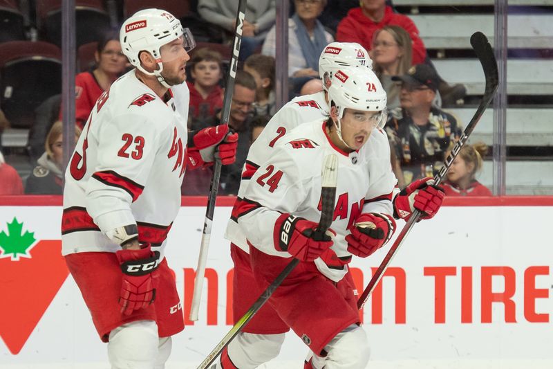 Dec 12, 2023; Ottawa, Ontario, CAN; Carolina Hurricanes center Seth Jarvis (24) skates to the bench after scoring in the second period against the Ottawa Senators at the Canadian Tire Centre. Mandatory Credit: Marc DesRosiers-USA TODAY Sports