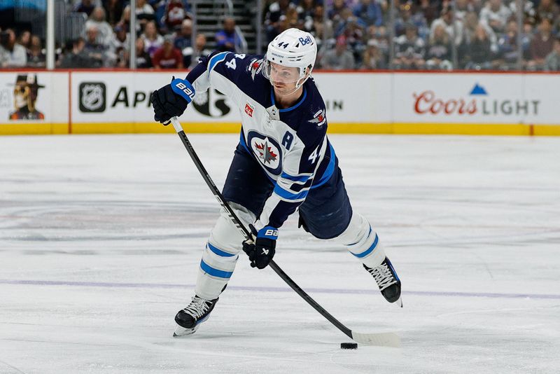 Apr 13, 2024; Denver, Colorado, USA; Winnipeg Jets defenseman Josh Morrissey (44) takes a shot in the first period against the Colorado Avalanche at Ball Arena. Mandatory Credit: Isaiah J. Downing-USA TODAY Sports