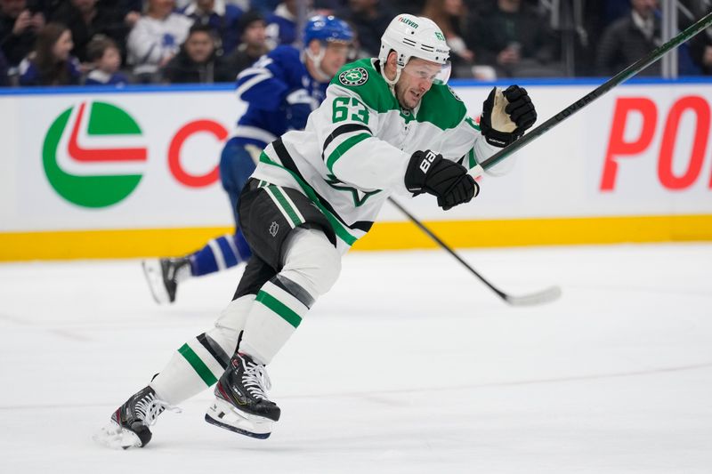 Jan 14, 2025; Toronto, Ontario, CAN; Dallas Stars forward Evgenii Dadonov (63) skates against the Toronto Maple Leafs during the second period at Scotiabank Arena. Mandatory Credit: John E. Sokolowski-Imagn Images