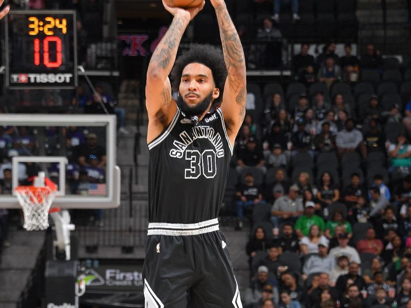 SAN ANTONIO, TX - MARCH 14: Julian Champagnie #30 of the San Antonio Spurs shoots the ball during the game against the Orlando Magic on March 14, 2023 at the AT&T Center in San Antonio, Texas. NOTE TO USER: User expressly acknowledges and agrees that, by downloading and or using this photograph, user is consenting to the terms and conditions of the Getty Images License Agreement. Mandatory Copyright Notice: Copyright 2023 NBAE (Photos by Michael Gonzales/NBAE via Getty Images)