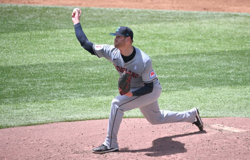 Jun 16, 2024; Toronto, Ontario, CAN;  Cleveland Guardians starting pitcher Ben Lively (39) delivers a pitch against the Toronto Blue Jays in the third inning at Rogers Centre. Mandatory Credit: Dan Hamilton-USA TODAY Sports