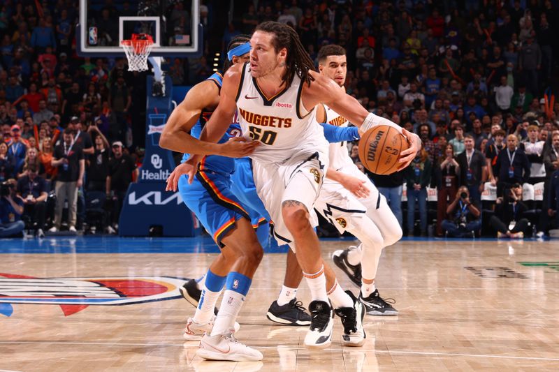 OKLAHOMA CITY, OK - JANUARY 31: Aaron Gordon #50 of the Denver Nuggets dribbles the ball during the game against the Oklahoma City Thunder on January 31, 2024 at Paycom Arena in Oklahoma City, Oklahoma. NOTE TO USER: User expressly acknowledges and agrees that, by downloading and or using this photograph, User is consenting to the terms and conditions of the Getty Images License Agreement. Mandatory Copyright Notice: Copyright 2024 NBAE (Photo by Zach Beeker/NBAE via Getty Images)