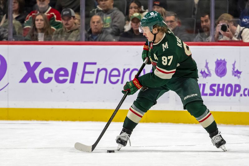 Nov 25, 2024; Saint Paul, Minnesota, USA;  Minnesota Wild forward Kirill Kaprizov (97) controls the puck against the Winnipeg Jets during the third period at Xcel Energy Center. Mandatory Credit: Nick Wosika-Imagn Images