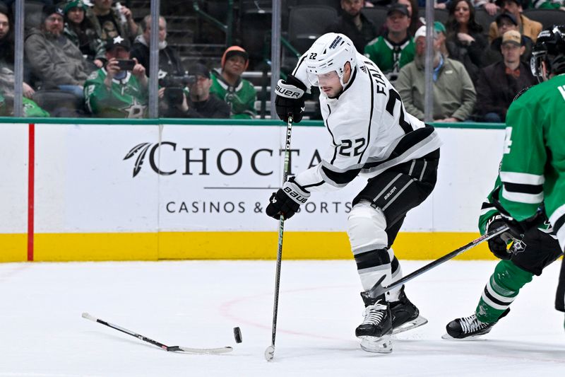 Jan 16, 2024; Dallas, Texas, USA; Los Angeles Kings left wing Kevin Fiala (22) attempts to shoot the puck past a broken stick during the third period against the Dallas Stars at the American Airlines Center. Mandatory Credit: Jerome Miron-USA TODAY Sports