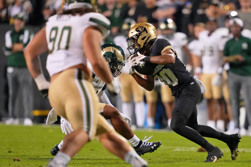 Sep 16, 2023; Boulder, Colorado, USA; Colorado Buffaloes wide receiver Xavier Weaver (10) runs with the ball against the Colorado State Rams during the first half at Folsom Field. Mandatory Credit: Andrew Wevers-USA TODAY Sports