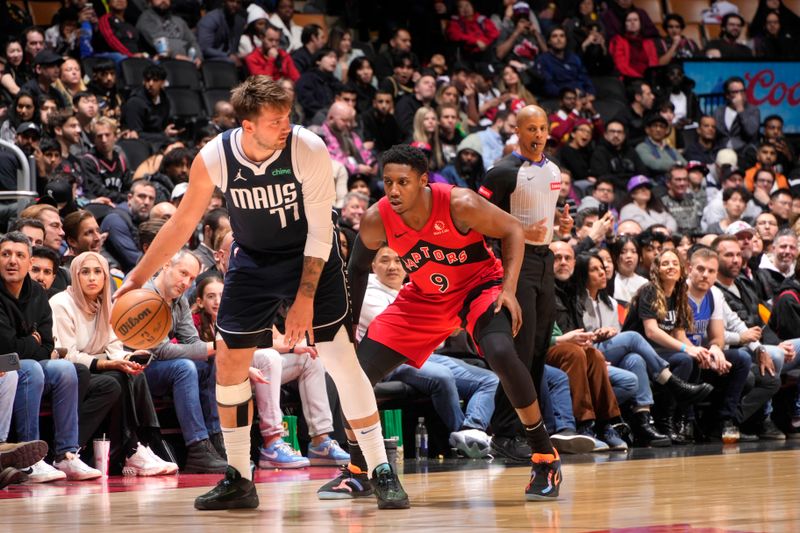 TORONTO, CANADA - FEBRUARY 28: Luka Doncic #77 of the Dallas Mavericks handles the ball during the game against the Toronto Raptors on February 28, 2024 at the Scotiabank Arena in Toronto, Ontario, Canada.  NOTE TO USER: User expressly acknowledges and agrees that, by downloading and or using this Photograph, user is consenting to the terms and conditions of the Getty Images License Agreement.  Mandatory Copyright Notice: Copyright 2024 NBAE (Photo by Mark Blinch/NBAE via Getty Images)