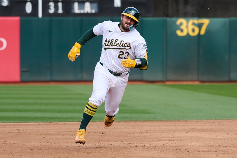 May 4, 2024; Oakland, California, USA; Oakland Athletics catcher Shea Langeliers (23) runs to third base after hitting a triple against the Miami Marlins during the second inning at Oakland-Alameda County Coliseum. Mandatory Credit: Robert Edwards-USA TODAY Sports