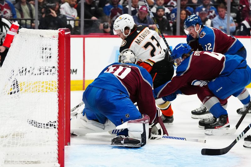 Nov 15, 2023; Denver, Colorado, USA; Anaheim Ducks center Mason McTavish (23) shoots the puck at Colorado Avalanche goaltender Alexandar Georgiev (40) in the third period at Ball Arena. Mandatory Credit: Ron Chenoy-USA TODAY Sports