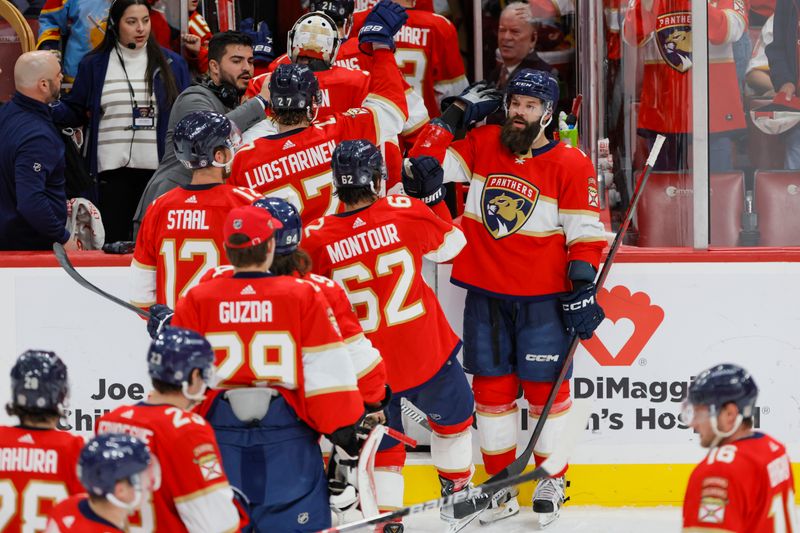 Apr 4, 2023; Sunrise, Florida, USA; Florida Panthers defenseman Radko Gudas (7) celebrates with teammates after winning the game against the Buffalo Sabres at FLA Live Arena. Mandatory Credit: Sam Navarro-USA TODAY Sports