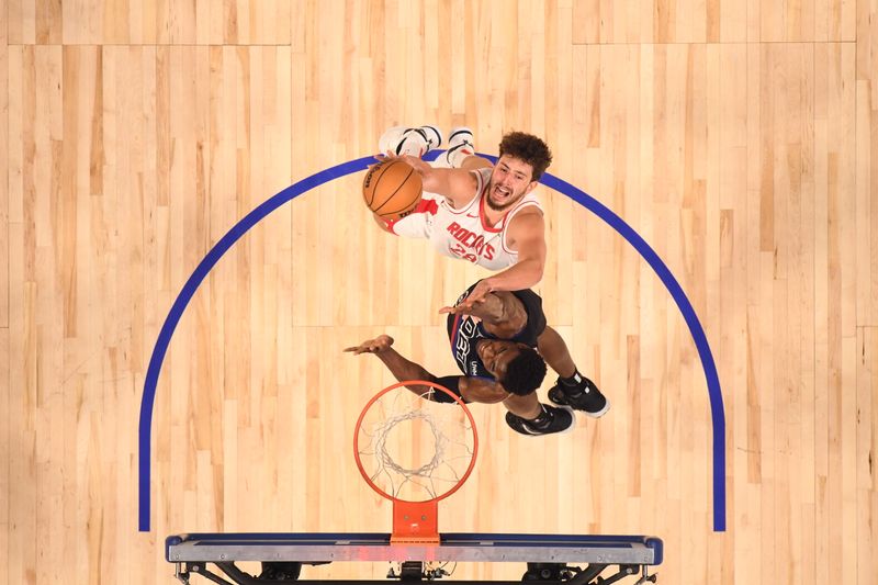 DETROIT, MI - JANUARY 12: Alperen Sengun #28 of the Houston Rockets drives to the basket during the game against the Detroit Pistons on January 12, 2024 at Little Caesars Arena in Detroit, Michigan. NOTE TO USER: User expressly acknowledges and agrees that, by downloading and/or using this photograph, User is consenting to the terms and conditions of the Getty Images License Agreement. Mandatory Copyright Notice: Copyright 2024 NBAE (Photo by Chris Schwegler/NBAE via Getty Images)