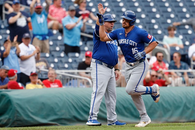 Sep 26, 2024; Washington, District of Columbia, USA; Kansas City Royals outfielder Hunter Renfroe (16) celebrates with Royals third baseman coach Vance Wilson (25) while rounding third base after hitting a solo home run against the Washington Nationals during the second inning at Nationals Park. Mandatory Credit: Geoff Burke-Imagn Images