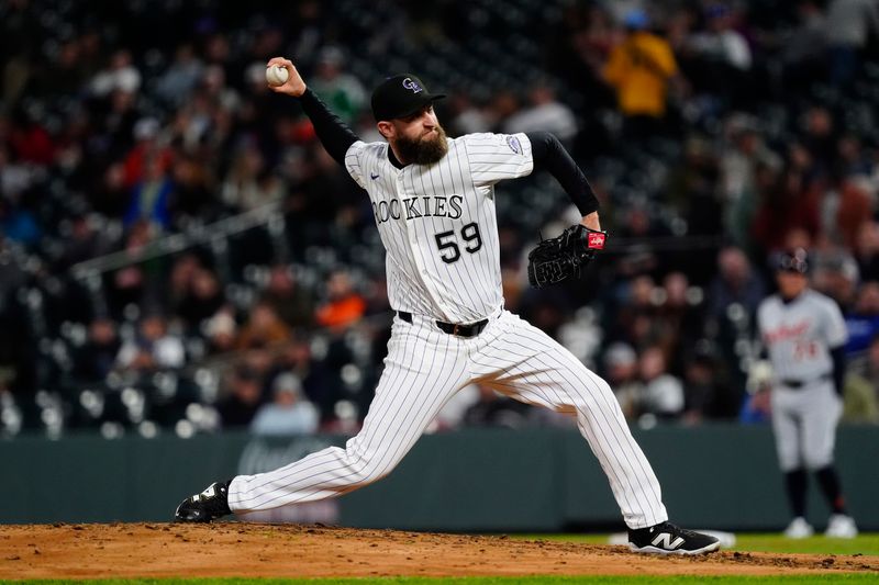 May 7, 2025; Denver, Colorado, USA; Colorado Rockies pitcher Jake Bird (59) delivers a pitch in the sixth inning against the Detroit Tigers at Coors Field. Mandatory Credit: Ron Chenoy-Imagn Images