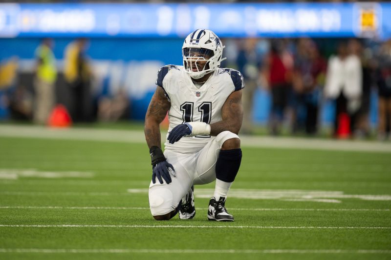 Dallas Cowboys linebacker Micah Parsons (11) sits on the field during an NFL football game against the Los Angeles Chargers, Monday, Oct. 16, 2023, in Inglewood, Calif. (AP Photo/Kyusung Gong)