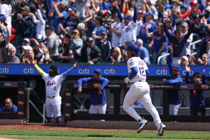 Apr 20, 2025; New York City, New York, USA;  New York Mets shortstop Francisco Lindor (12) hits a solo home run during the first inning against the St. Louis Cardinals at Citi Field. Mandatory Credit: Vincent Carchietta-Imagn Images