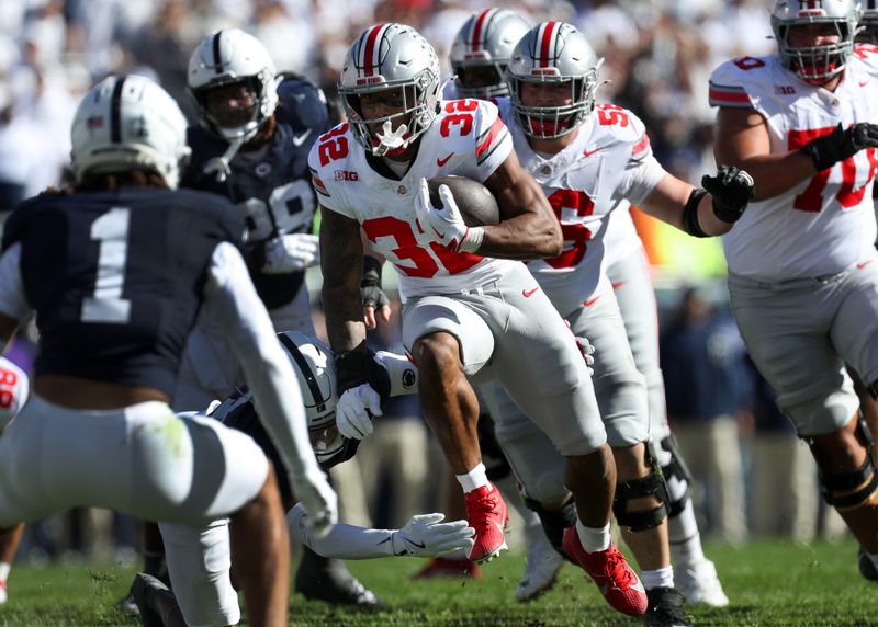 Nov 2, 2024; University Park, Pennsylvania, USA; Ohio State Buckeyes running back TreVeyon Henderson (32) runs with the ball during the second quarter against the Penn State Nittany Lions at Beaver Stadium. Mandatory Credit: Matthew O'Haren-Imagn Images