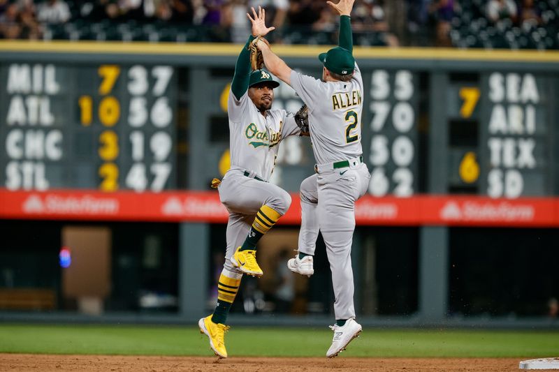 Jul 28, 2023; Denver, Colorado, USA; Oakland Athletics left fielder Tony Kemp (5) celebrates with shortstop Nick Allen (2) after the game against the Colorado Rockies at Coors Field. Mandatory Credit: Isaiah J. Downing-USA TODAY Sports