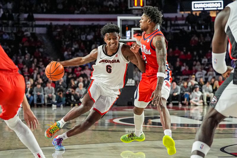 Jan 14, 2026; Athens, Georgia, USA; Georgia Bulldogs forward Kanon Catchings (6) dribbles against Mississippi Rebels guard AJ Storr (2) during the first half at Stegeman Coliseum. Mandatory Credit: Dale Zanine-Imagn Images