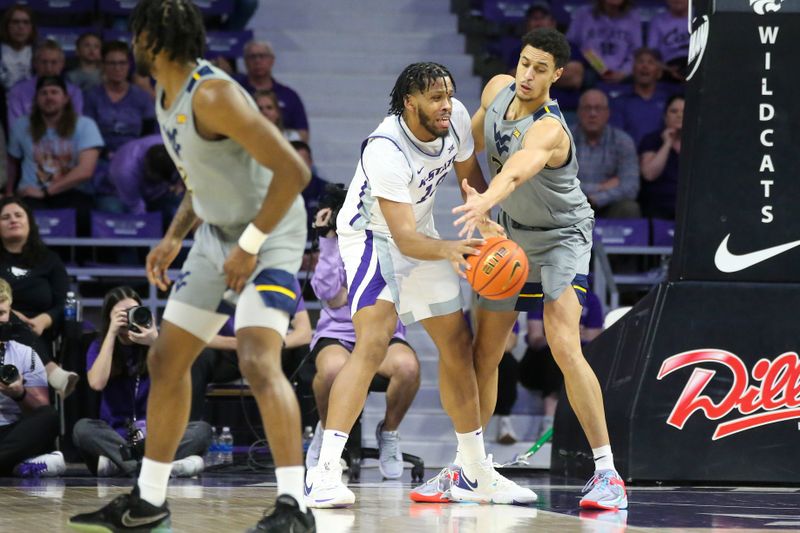 Feb 26, 2024; Manhattan, Kansas, USA; Kansas State Wildcats center Will McNair Jr. (13) passes the ball away from West Virginia Mountaineers center Jesse Edwards (7) during the second half at Bramlage Coliseum. Mandatory Credit: Scott Sewell-USA TODAY Sports