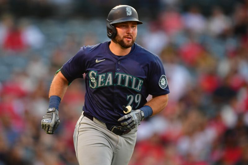 Jul 11, 2024; Anaheim, California, USA; Seattle Mariners catcher Cal Raleigh (29) runs after hitting a solo home run against the Los Angeles Angels during the third inning at Angel Stadium. Mandatory Credit: Gary A. Vasquez-USA TODAY Sports