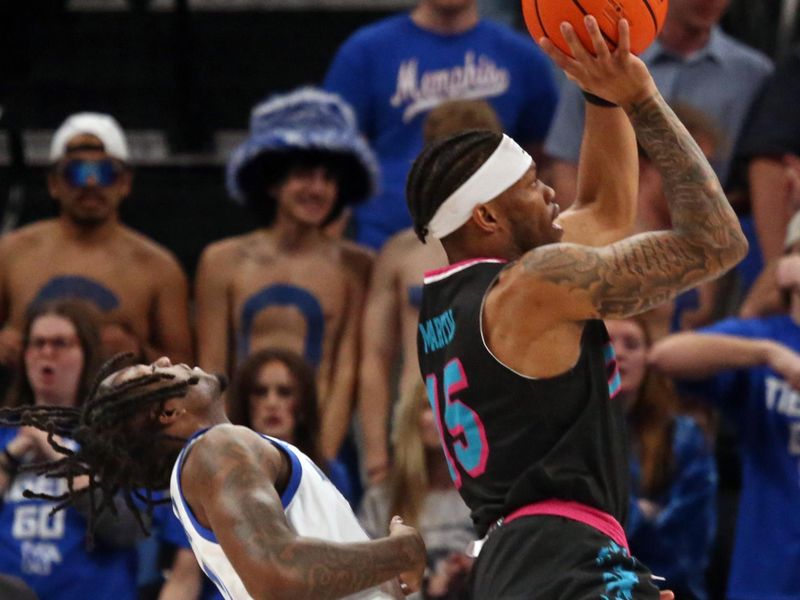 Feb 25, 2024; Memphis, Tennessee, USA; Florida Atlantic Owls guard Alijah Martin (15) shoots as Memphis Tigers guard Jaykwon Walton (10) defends during the first half at FedExForum. Mandatory Credit: Petre Thomas-USA TODAY Sports