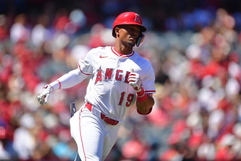 Apr 6, 2025; Anaheim, California, USA; Los Angeles Angels second baseman Kyren Paris (19) runs after hitting a single against the Cleveland Guardians during the second inning at Angel Stadium. Mandatory Credit: Gary A. Vasquez-Imagn Images