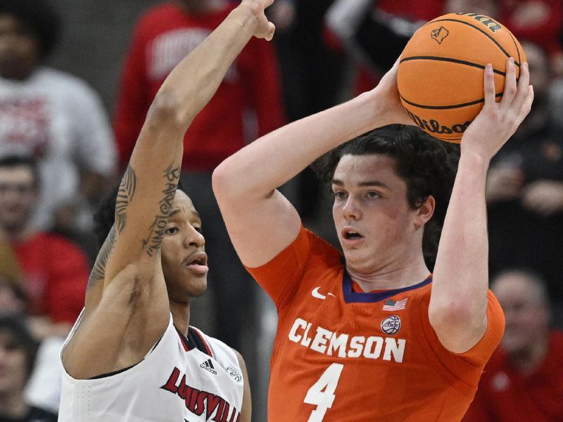 Feb 18, 2023; Louisville, Kentucky, USA;  Clemson Tigers forward Ian Schieffelin (4) looks to pass under the pressure of Louisville Cardinals forward JJ Traynor (12) during the second half at KFC Yum! Center. Louisville defeated Clemson 83-73. Mandatory Credit: Jamie Rhodes-USA TODAY Sports