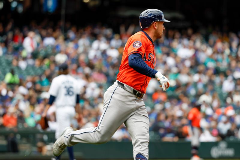 May 30, 2024; Seattle, Washington, USA; Houston Astros third baseman Alex Bregman (2) hits a two-run home run against the Seattle Mariners during the fourth inning at T-Mobile Park. Mandatory Credit: Joe Nicholson-USA TODAY Sports