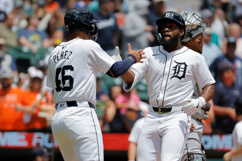 Jun 23, 2024; Detroit, Michigan, USA;  Detroit Tigers center fielder Akil Baddoo (60) celebrates with right fielder Wenceel Perez (46) after hitting a two-run home run in the first inning against the Chicago White Sox at Comerica Park. Mandatory Credit: Rick Osentoski-USA TODAY Sports