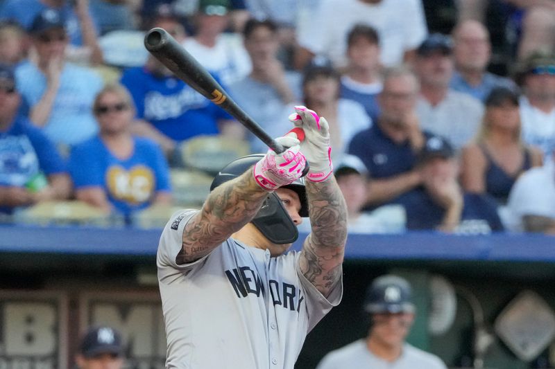 Jun 12, 2024; Kansas City, Missouri, USA;  New York Yankees left fielder Alex Verdugo (24) hits a two run single against the Kansas City Royals in the first inning at Kauffman Stadium. Mandatory Credit: Denny Medley-USA TODAY Sports