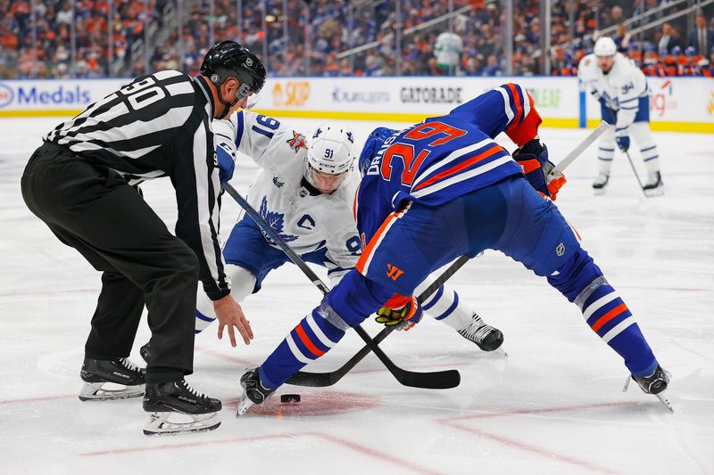 Jan 16, 2024; Edmonton, Alberta, CAN; Edmonton Oilers forward Leon Draisaitl (29) wins a face-off against Toronto Maple Leafs forward John Tavares (91) during the second period at Rogers Place. Mandatory Credit: Perry Nelson-USA TODAY Sports