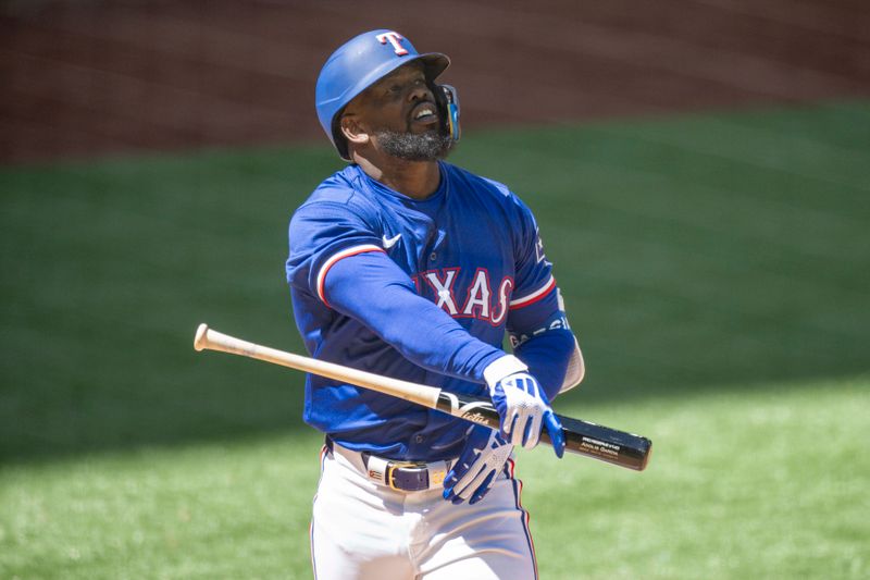 Mar 26, 2024; Arlington, Texas, USA; Texas Rangers right fielder Adolis Garcia (53) reacts to striking out against the Boston Red Sox during the game at Globe Life Field. Mandatory Credit: Jerome Miron-USA TODAY Sports