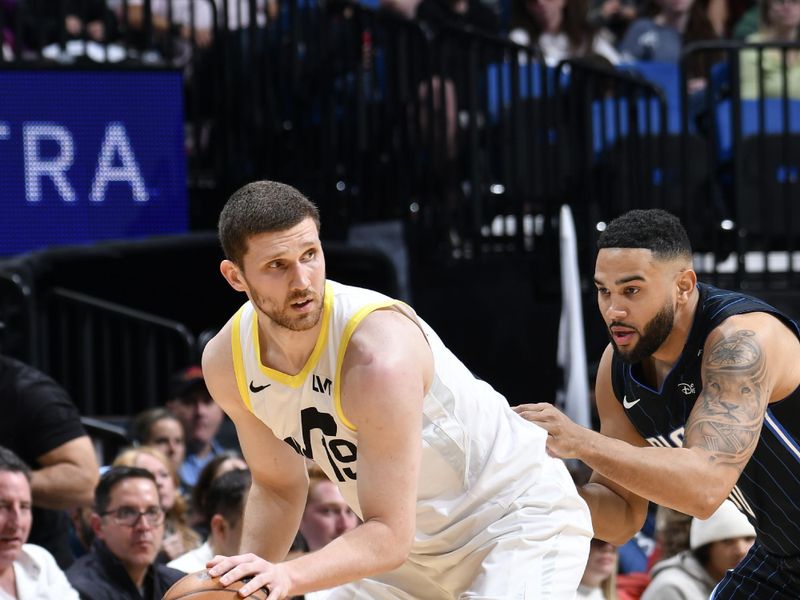 ORLANDO, FL - JANUARY 5 :  Svi Mykhailiuk #19 of the Utah Jazz dribbles the ball during the game against the Orlando Magic on January 5, 2025 at Kia Center in Orlando, Florida. NOTE TO USER: User expressly acknowledges and agrees that, by downloading and or using this photograph, User is consenting to the terms and conditions of the Getty Images License Agreement. Mandatory Copyright Notice: Copyright 2025 NBAE (Photo by Fernando Medina/NBAE via Getty Images)