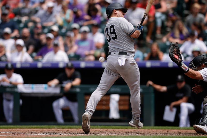 Jul 16, 2023; Denver, Colorado, USA; New York Yankees catcher Jose Trevino (39) is hit by a pitch in the fifth inning against the Colorado Rockies at Coors Field. Mandatory Credit: Isaiah J. Downing-USA TODAY Sports