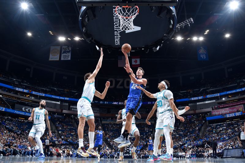 ORLANDO, FL - NOVEMBER 12: Franz Wagner #22 of the Orlando Magic shoots the ball during the Emirates NBA Cup game against the Charlotte Hornets on November 12, 2024 at Kia Center in Orlando, Florida. NOTE TO USER: User expressly acknowledges and agrees that, by downloading and or using this photograph, User is consenting to the terms and conditions of the Getty Images License Agreement. Mandatory Copyright Notice: Copyright 2024 NBAE (Photo by Fernando Medina/NBAE via Getty Images)