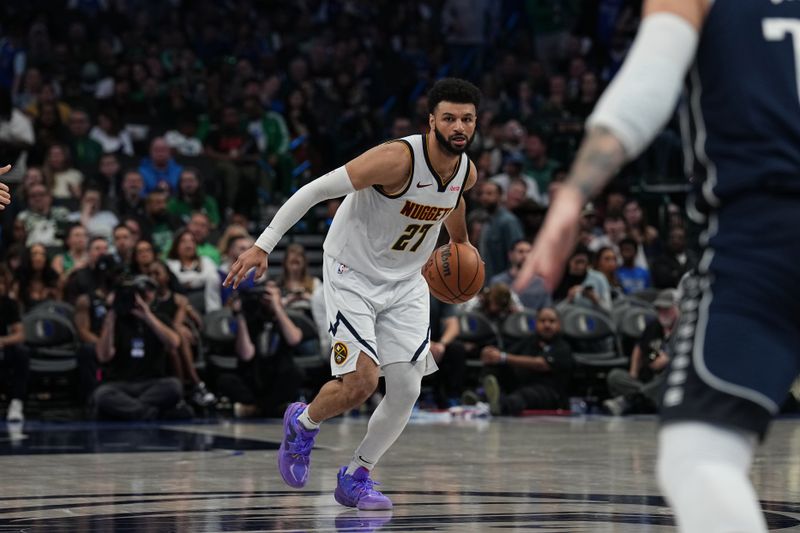 DALLAS, TX - MARCH 17: Jamal Murray #27 of the Denver Nuggets handles the ball during the game against the Dallas Mavericks on March 17, 2024 at the American Airlines Center in Dallas, Texas. NOTE TO USER: User expressly acknowledges and agrees that, by downloading and or using this photograph, User is consenting to the terms and conditions of the Getty Images License Agreement. Mandatory Copyright Notice: Copyright 2024 NBAE (Photo by Glenn James/NBAE via Getty Images)