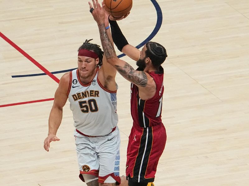 DENVER, CO - JUNE 12: Caleb Martin #16 of the Miami Heat shoots the ball during the game  during Game Five of the 2023 NBA Finals on June 12, 2023 at the Ball Arena in Denver, Colorado. NOTE TO USER: User expressly acknowledges and agrees that, by downloading and/or using this Photograph, user is consenting to the terms and conditions of the Getty Images License Agreement. Mandatory Copyright Notice: Copyright 2023 NBAE (Photo by Bart Young/NBAE via Getty Images)