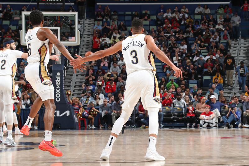 NEW ORLEANS, LA - FEBRUARY 22: Herb Jones #5 and CJ McCollum #3 of the New Orleans Pelicans high fives during the game against the Houston Rockets on February 22, 2024 at the Smoothie King Center in New Orleans, Louisiana. NOTE TO USER: User expressly acknowledges and agrees that, by downloading and or using this Photograph, user is consenting to the terms and conditions of the Getty Images License Agreement. Mandatory Copyright Notice: Copyright 2024 NBAE (Photo by Layne Murdoch Jr./NBAE via Getty Images)