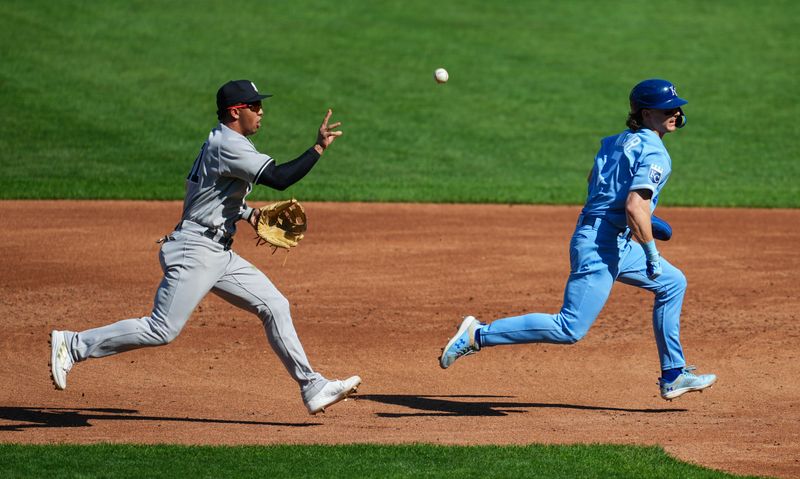 Oct 1, 2023; Kansas City, Missouri, USA; Kansas City Royals shortstop Bobby Witt Jr. (7) is caught in a rundown by New York Yankees second baseman Oswald Peraza (91) during the third inning at Kauffman Stadium. Mandatory Credit: Jay Biggerstaff-USA TODAY Sports